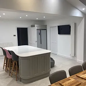 a large kitchen with a center island in the middle of the room
